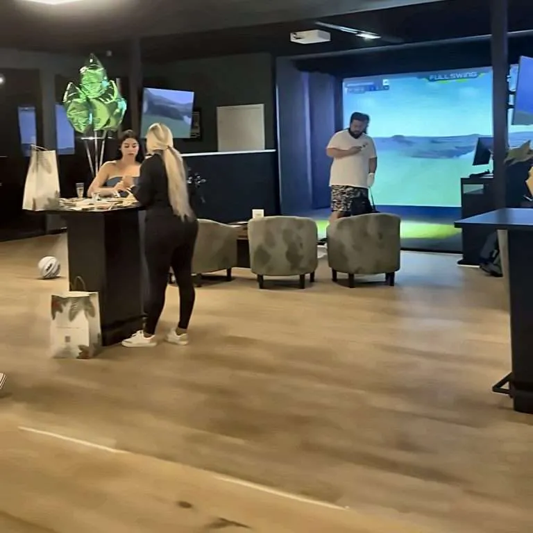 Golfer's Den front desk and simulator lounge in Kendall